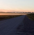 [Dawn's Kiss] - morning mist, field, gravel road, sun, sunrise